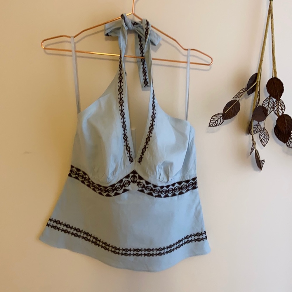 Light blue halter neck top.